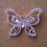 S 6660 B - Silver Butterfly brooch covered in rhinestones